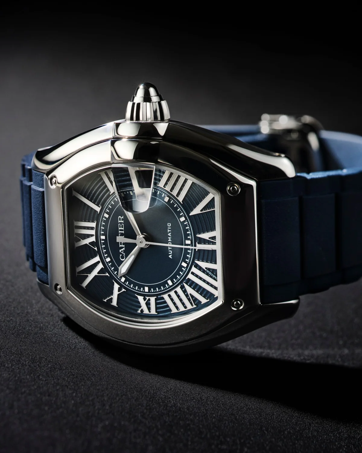 Stylish blue and silver watch with a textured dial and Roman numeral markers.